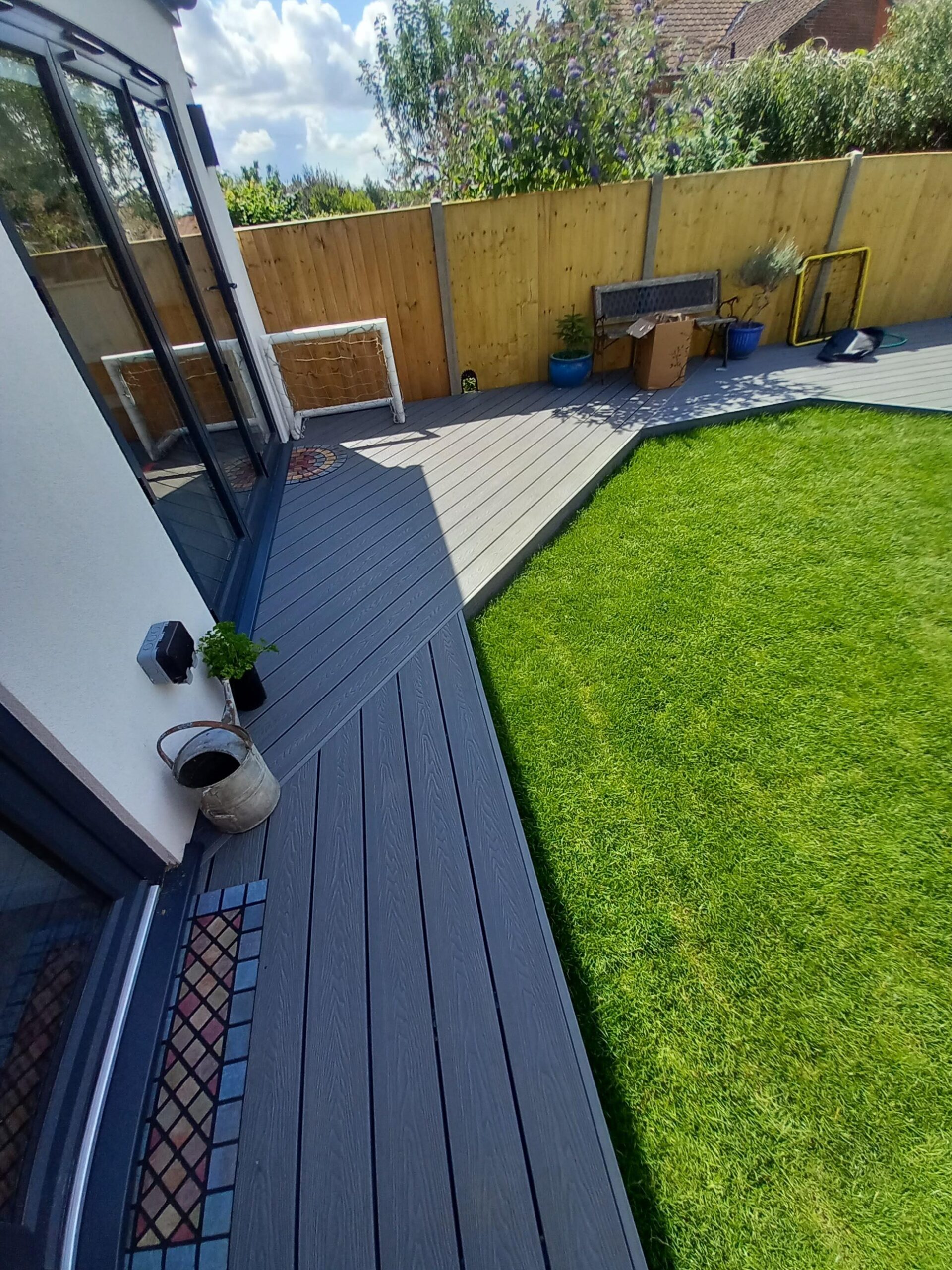 grey composite decking norwich with fresh turf and new fencing