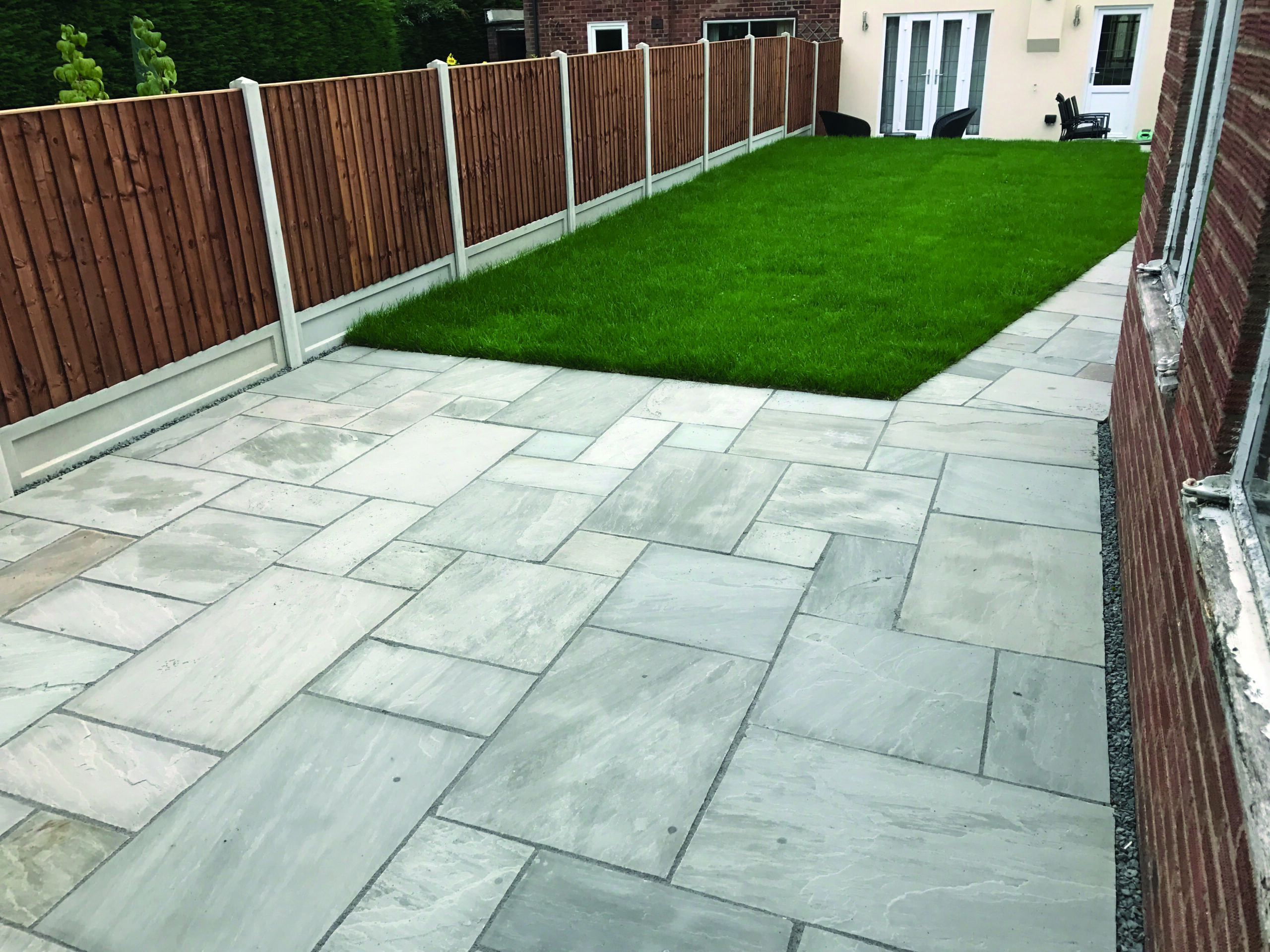 paving installation with grey slabs of varying sizes in norwich by Green Machine Norwich